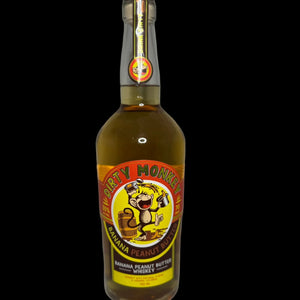 Bottle of Dirty Monkey Banana Peanut Butter Whiskey on a white background