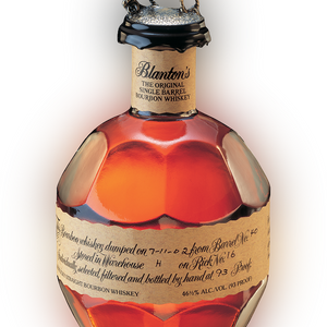 Bottle of Blanton's Single Barrel Whiskey with decorative cap on a white background
